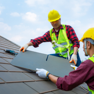 Construction Workers Repairing roof tiles, with common roof repairs