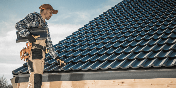 roof inspector on roof for post-installation roof inspection